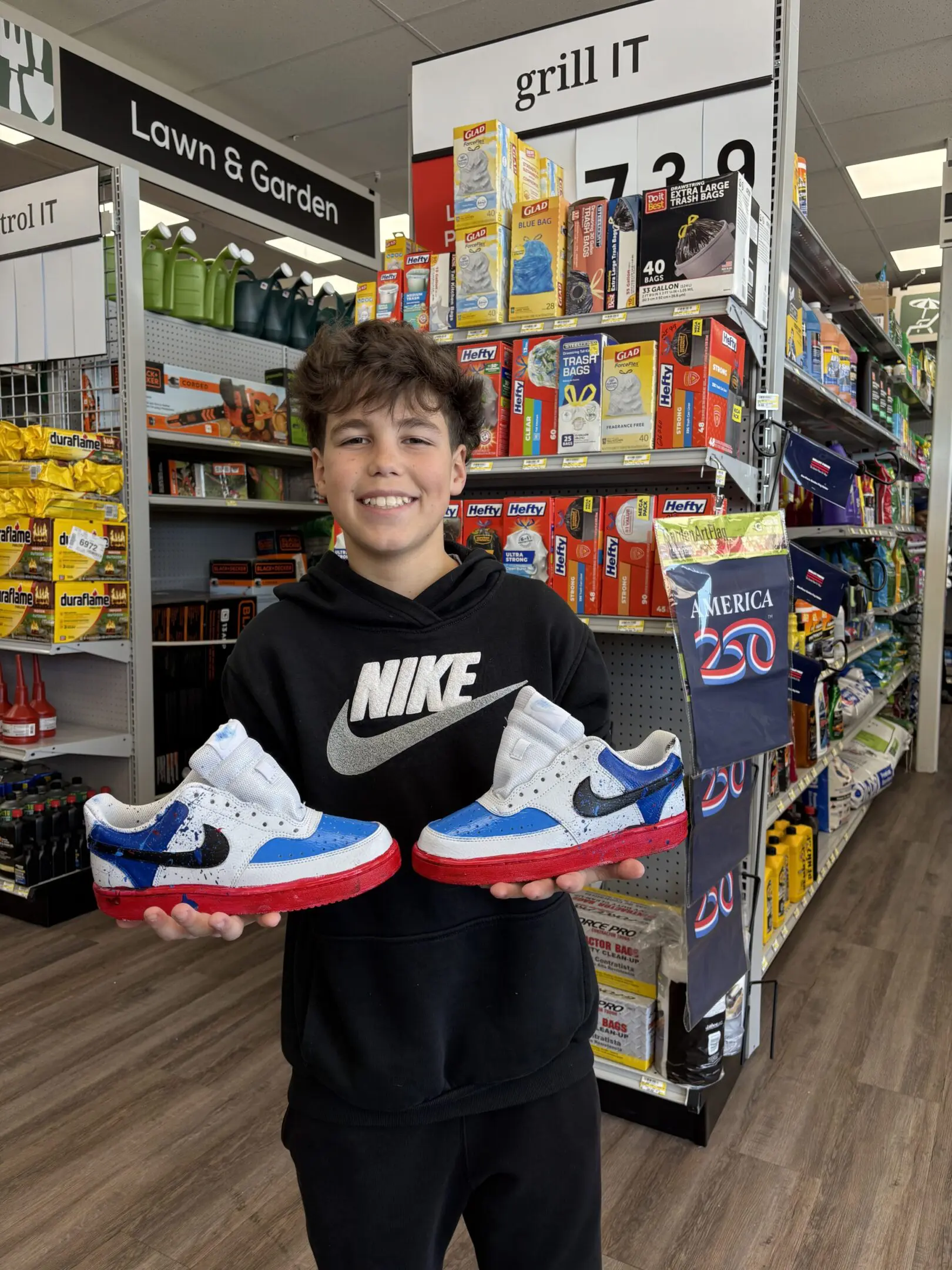 Young man holding colorful sneakers in a store.